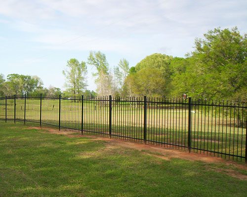 Durable iron fencing with classic black powder finish.