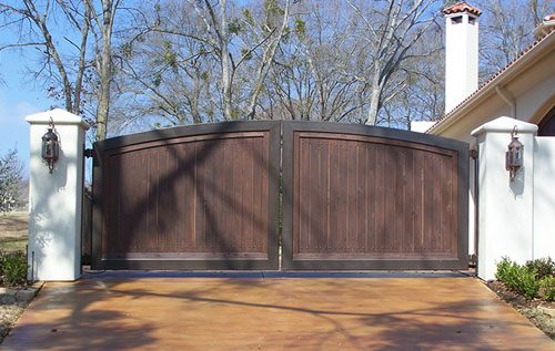 Modern Arch Iron Frame supports Rich Dark Wood Panels for Contemporary look with Privacy.