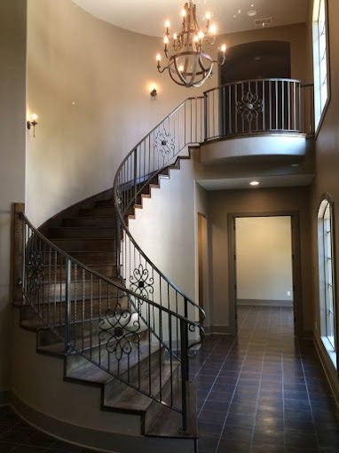 Elegant wrought iron railings with decorative scrollwork and ornamental accents.